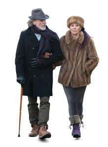 cut out elderly couple walking arm in arm in winter