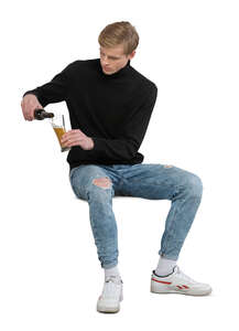 cut out man sitting in a bar and drinking beer