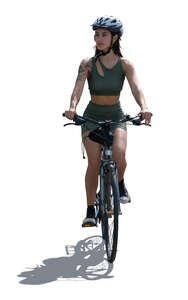 cut out backlit sporty woman riding a bike