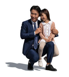 cut out man with his little daughter squatting