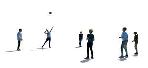 cut out backlit group of children playing volleyball