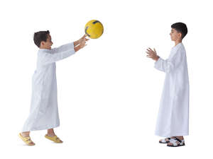 two cut out arab boys in traditional clothing playing ball