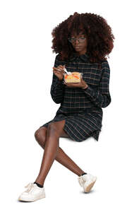 cut out woman sitting and eating salad