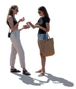 two cut out women standing and eating strawberries