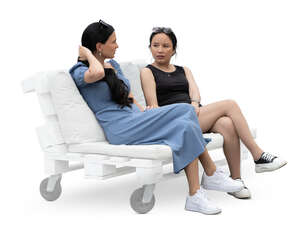 two cut out women sitting on the sofa and talking