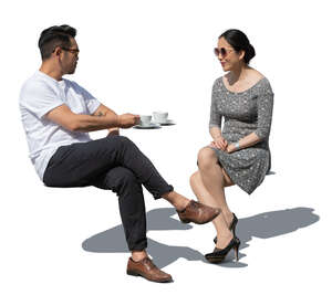 cut out asian man and woman sitting in a cafe