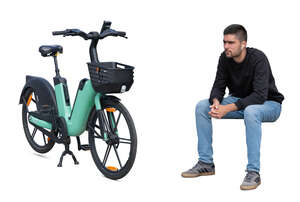 cut out man sitting next to his electric rental bike