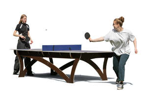 two cut out young women playing table tennis outside