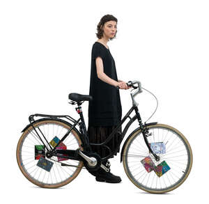 cut out woman in a black dress walking with a bike