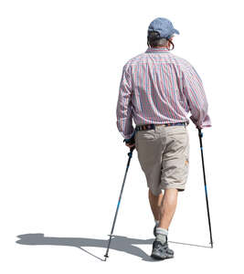 cut out older man with two nordic walking sticks walking