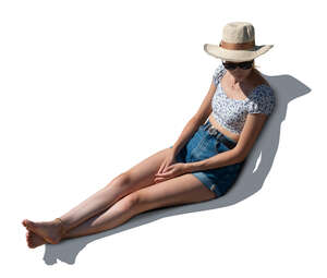 cut out woman sitting on a sofa outside