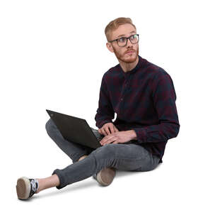 cut out man with a laptop sitting on the floor