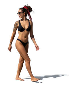 cut out woman in bikini walking on the beach