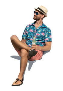 cut out man with a summer hat sitting and drinking a soft drink