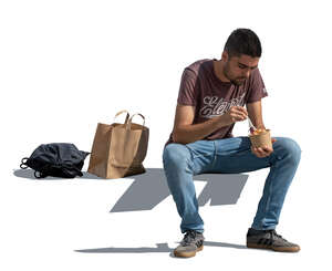 cut out man sitting and eating lunch