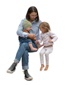 cut out woman with two little kids sitting