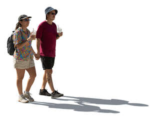 cut out backlit couple from south america walking and drinking ice drinks