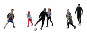 cut out group of children playing football at a sport class
