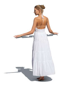 cut out woman in a white summer dress standing on a balcony