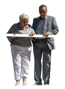 cut out two people standing on a balcony and lookinf down