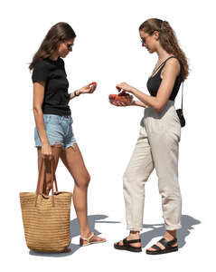 two cut out women standing and eating strawberries