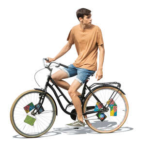 cut out young man riding a bike