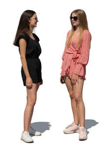 two cut out young women standing and talking