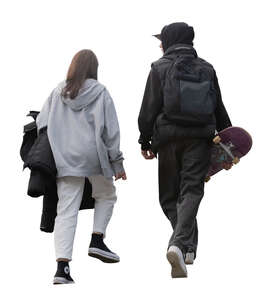 two teenagers with skateboard walking up the stairs