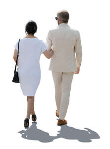 cut out backlit couple in white summer party clothes walking arm in arm