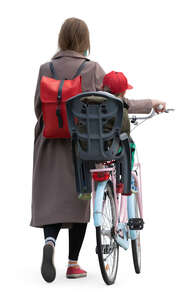 woman pushing a bike with her daughte sitting on it