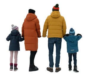 family in winter standing by a railing and looking out