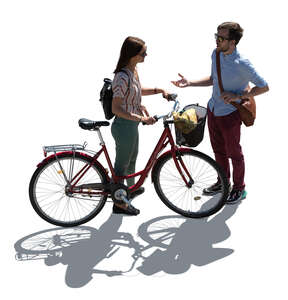 backlit top view image of woman with bicycle talking with a man