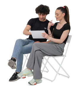 cut out man and woman sitting and discussing thing over tablet