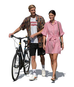 two cut out young people with a bike walking on a sunny summer day