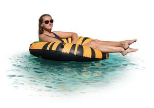 cut out woman relaxing on the large floatie in the pool