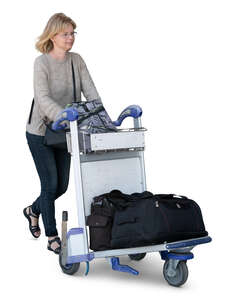 woman pushing an airport trolley walking
