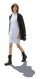 backlit woman in boots walking