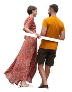 two people standing up on a balcony and talking