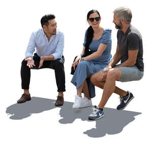 cut out backlit group of people sitting and talking