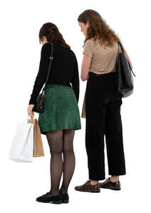 two women standing in a shop and looking down on a counter