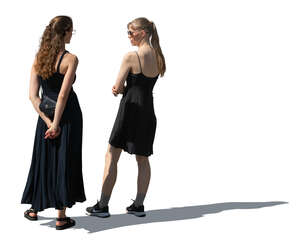 two women wearing black dresses standing
