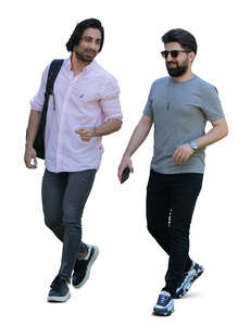 two dark haired men walking and talking