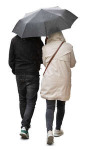 two cut out people walking under one umbrella