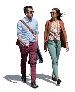 man and woman walking side by side and talking
