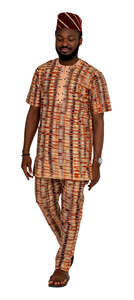 african man in ethnic outfit walking