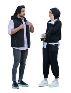young muslim woman with a hijab talking to a man