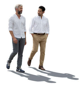 two backlit men walking