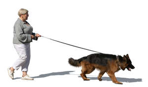 older woman walking a dog