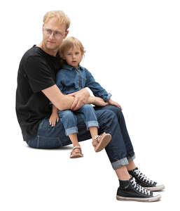 man sitting with her daghter on his lap