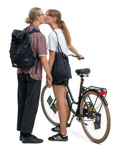 woman with a bike standing and kissing her boyfriend
